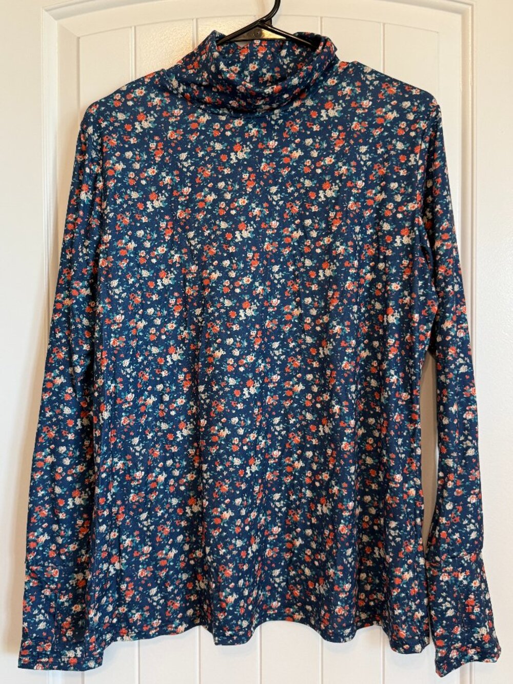 Pretty navy blue long-sleeve top with a small floral pattern